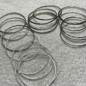 Multiple silver bracelets
